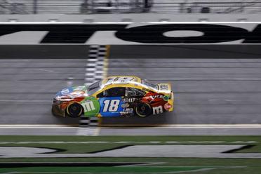 Kyle Busch drives the number 18 M&M's Fudge Brownie Toyota during