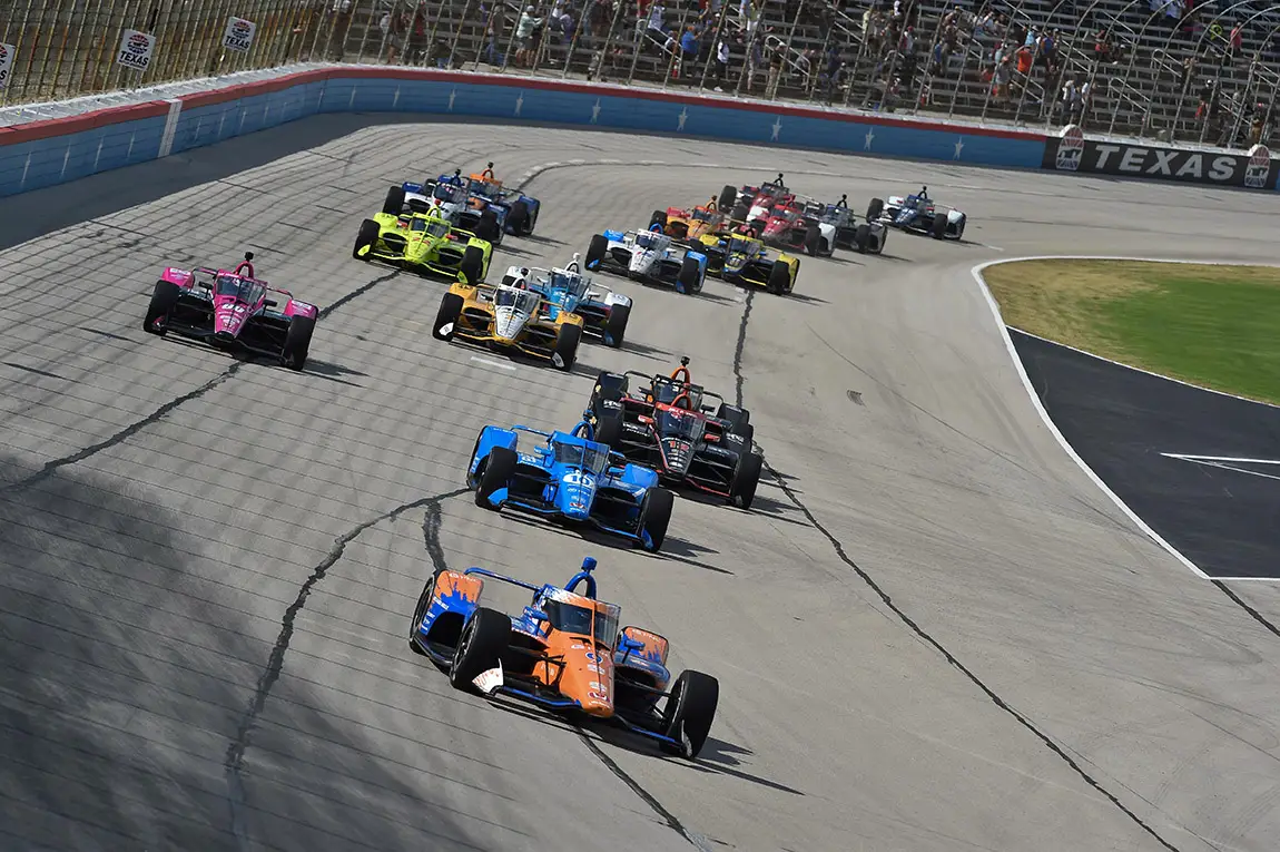 Scott Dixon leads the field into Turn 1 of the Genesys 300 at Texas Motor Speedway.