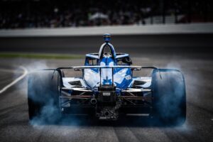Scott Dixon lights up the tires exiting pit road during Indy 500 qualifying.
