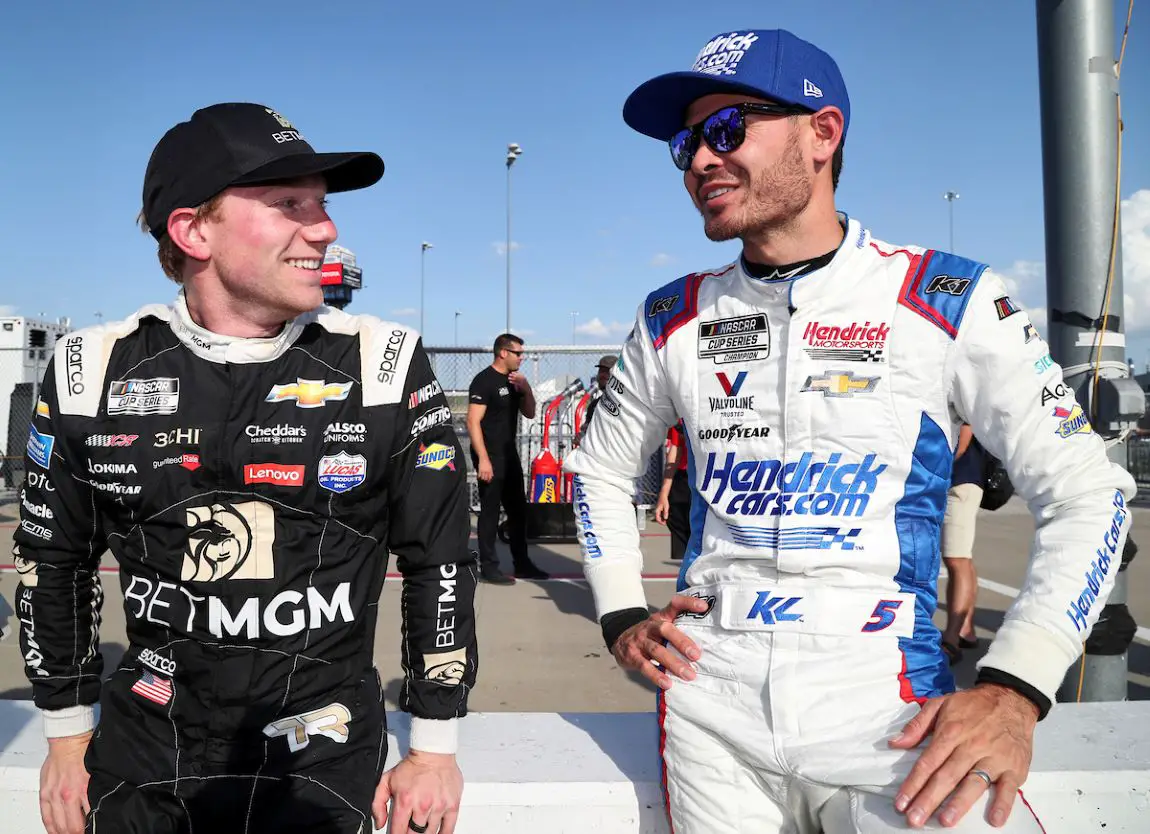 Tyler Reddick (left) chats with Kyle Larson (right) at Kansas.