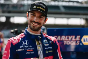 Alexander Rossi smiles on pit-road at the Indianapolis Motor Speedway.