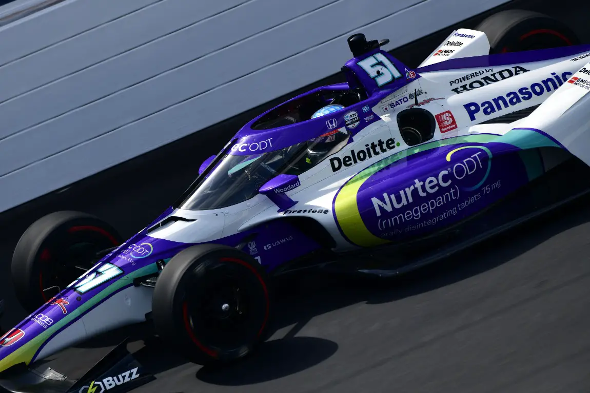 Takuma Sato pilots the No. 51 Dale Coyne Racing with RWR Honda down the front stretch at the Indianapolis Motor Speedway.