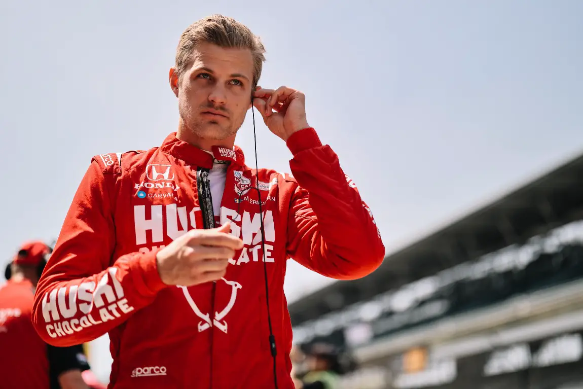 Marcus Ericsson stands on pit-road at the Indianpolis Motor Speedway.