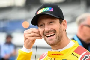 Romain Grosjean smiles on pit-road at the Indianapolis Motor Speedway.