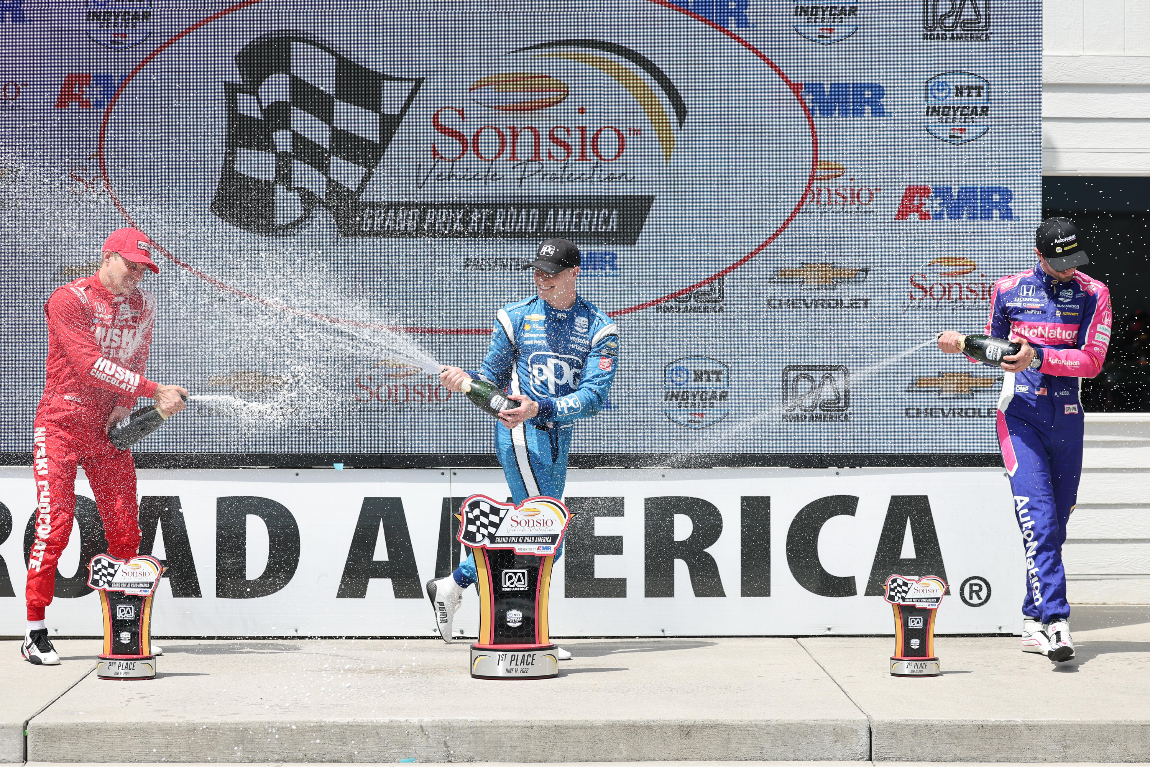 The Sonsio Grand Prix podium finishers celebrate at Road America.