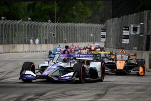 The 2022 NTT IndyCar Series field drives around the Raceway at Belle Isle Park.