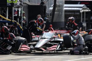 The No. 12 Team Penske pit-crew performs a pit-stop during the Detriot Grand Prix.