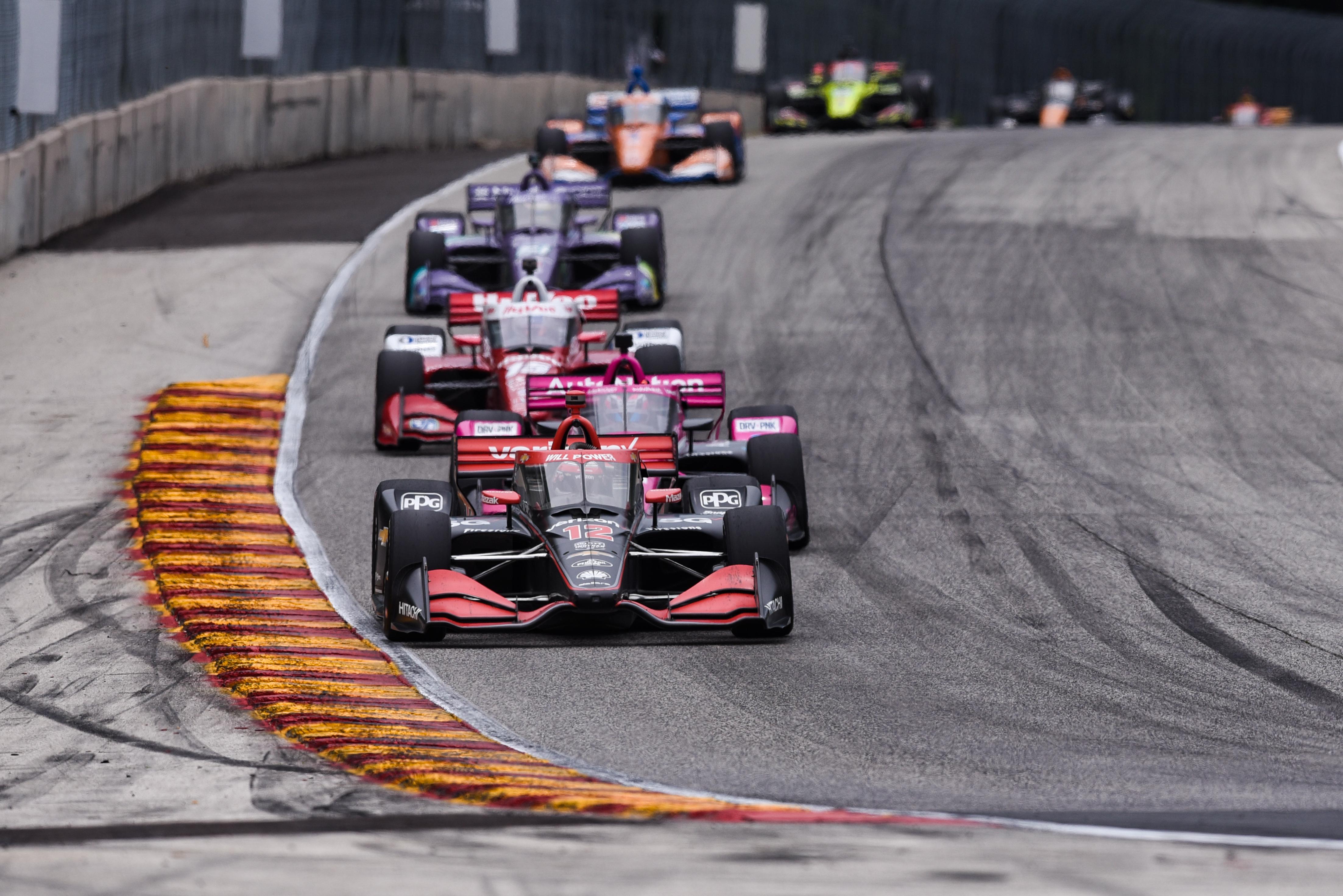 The 2021 NTT IndyCar Series field drives around Road America.