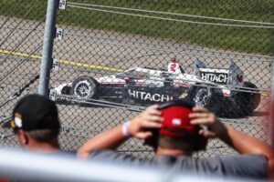 Josef Newgarden's crashed car sliding to a stop after the 2022 Hy-Vee Salute to Farmers 300 at Iowa Speedway.