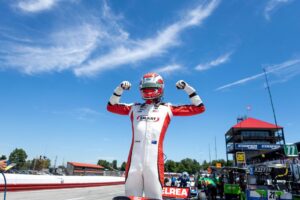 Hunter McElrea celebrates after winning the pole at Mid-Ohio.