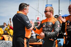 Felix Rosenqvist and Zak Brown before the 2022 Firestone Grand Prix of Monterey.