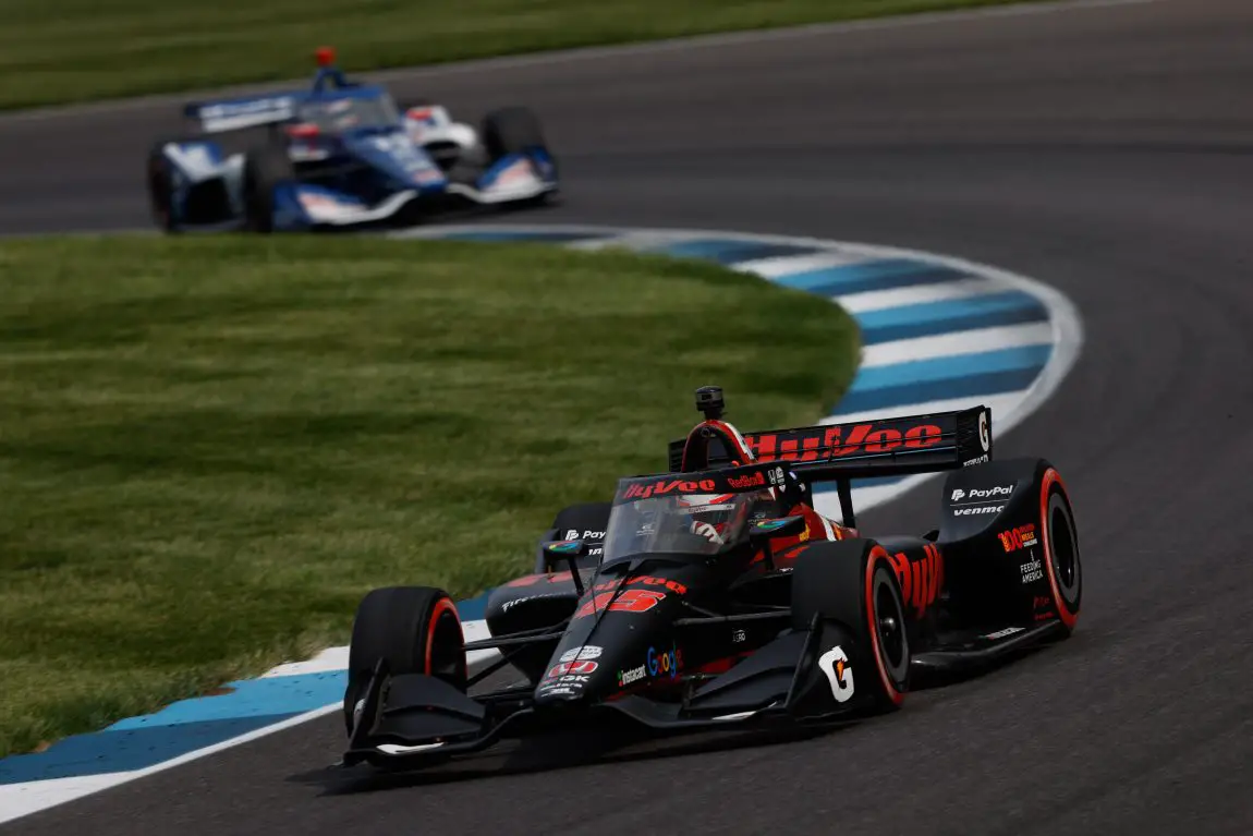 Christian Lundgaard leads 2023 GMR Grand Prix race winner Alex Palou around the Indianapolis Motor Speedway road course.