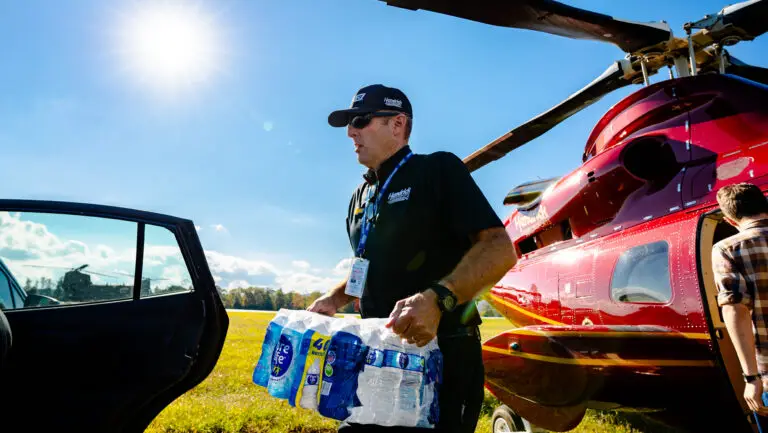 A Hendrick Motorsports team member delivers relief supplies to western North Carolina