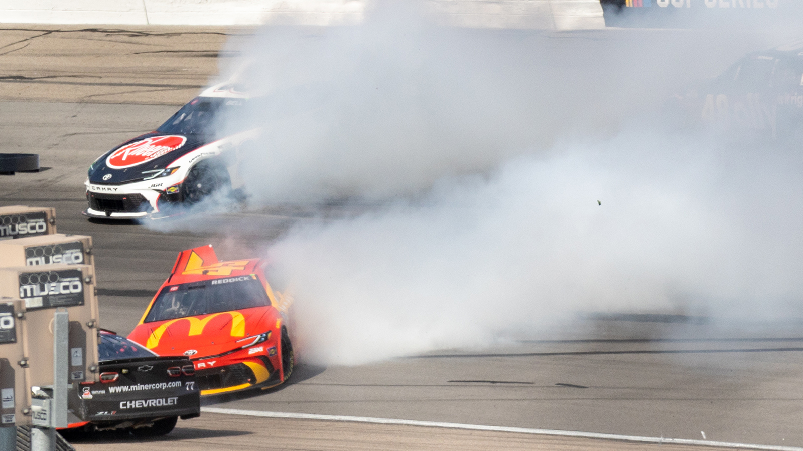 Tyler Reddick and Christopher Bell spin after contact from Chase Briscoe at Iowa Speedway