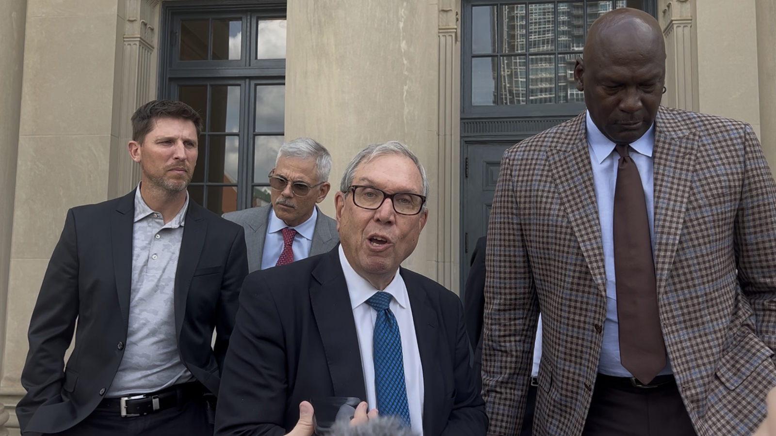 Jeffrey Kessler, Michael Jordan, Curtis Polk, and Denny Hamlin after an August 28 courtdate against NASCAR.