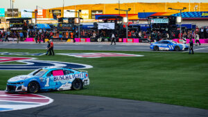 Ross Chastain's car sits in the frontstretch grass after a last-ditch effort to advance in the Playoffs at the Bank of America Roval 400 at the Charlotte Roval