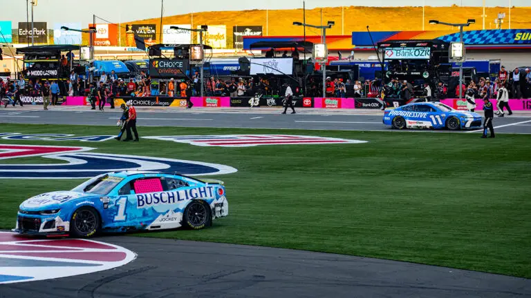 Ross Chastain's car sits in the frontstretch grass after a last-ditch effort to advance in the Playoffs at the Bank of America Roval 400 at the Charlotte Roval