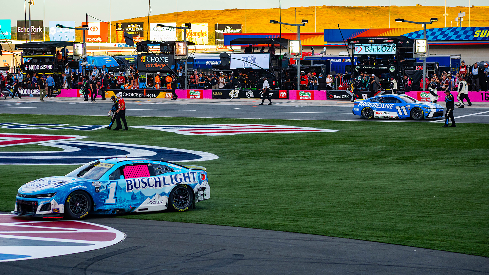 Ross Chastain's car sits in the frontstretch grass after a last-ditch effort to advance in the Playoffs at the Bank of America Roval 400 at the Charlotte Roval