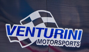 The Venturini Motorsports logo on the side of a team hauler.