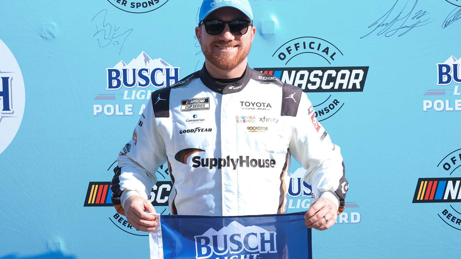 Tyler Reddick celebrates his third pole position of the season after turning the fastest lap in qualifying for the AdventHealth 400 at Kansas Speedway.
