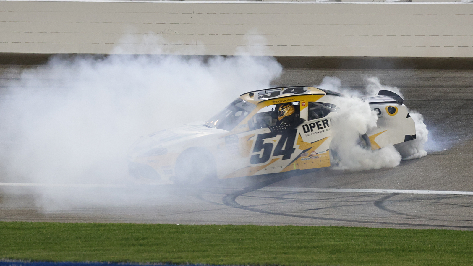 Taylor Gray celebrates a win in the NASCAR O'Reilly Auto Parts Series Kansas Lottery 300.