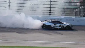 Tyler Reddick performs a burnout after winning the AdventHealth 400 at Kansas Speedway.