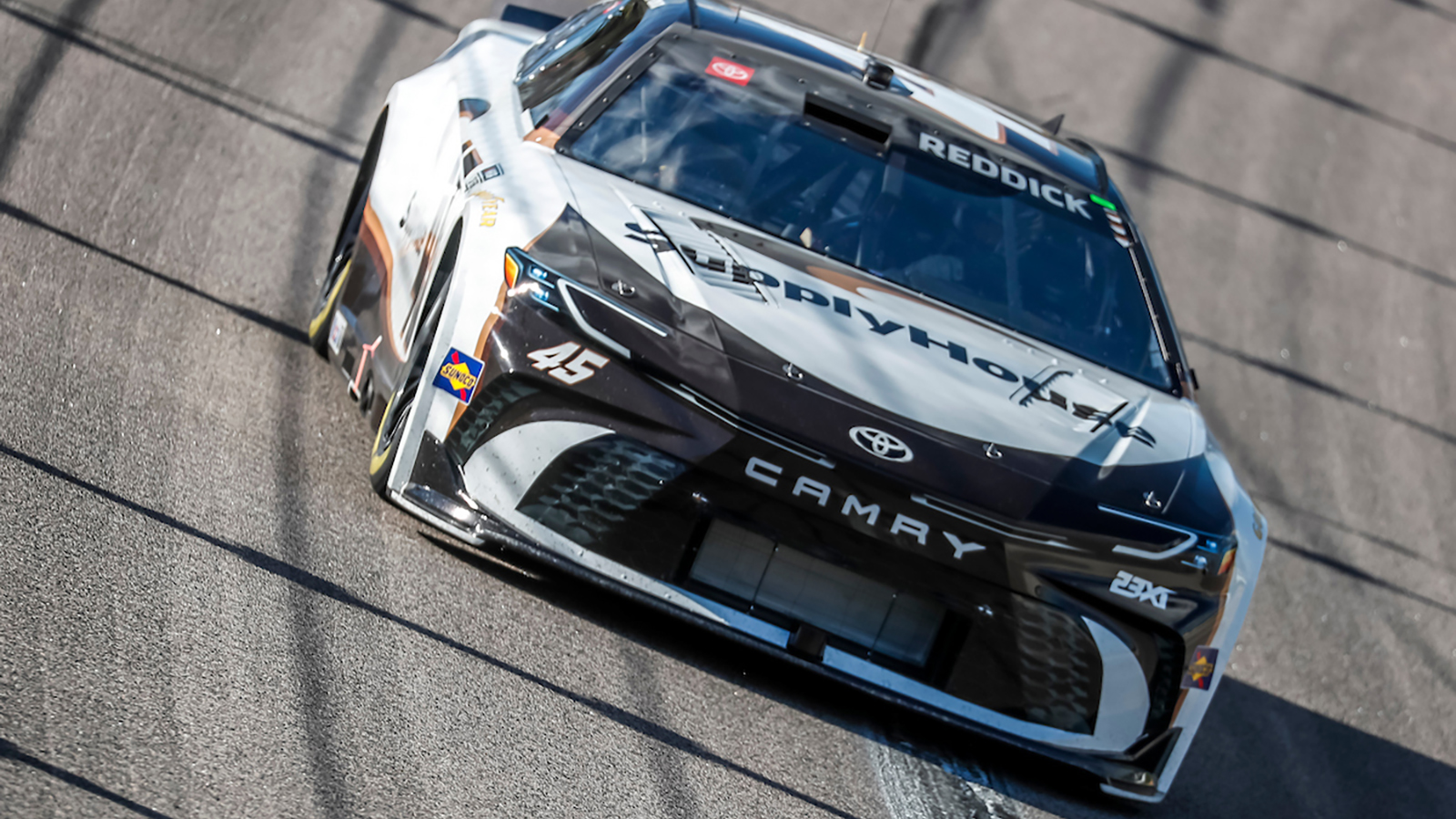 Tyler Reddick charged to the pole position for Sunday's AdventHealth 400 at Kansas Speedway. Here's the full starting lineup.