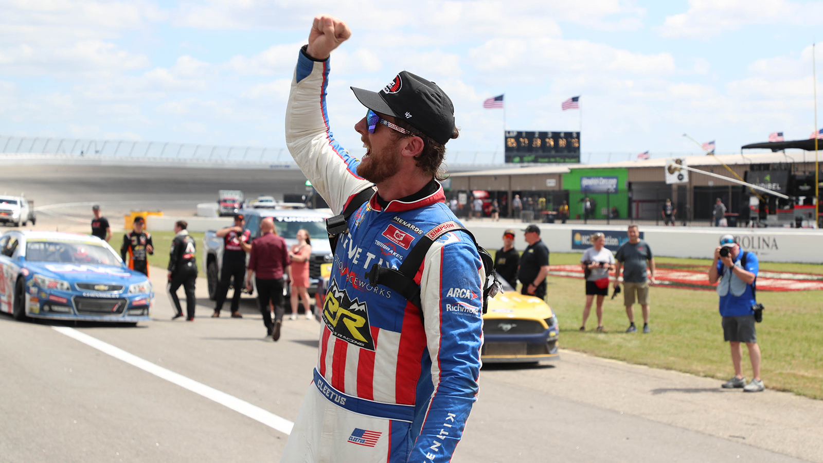 Cleetus McFarland plays to the crowd after securing a fourth-place finish in the ARCA East event at Rockingham Speedway.