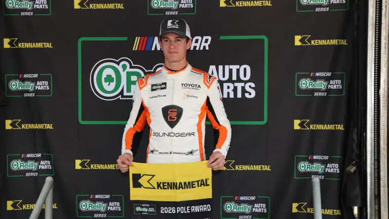 William Sawalich poses with the pole award flag at Bristol Motor Speedway.