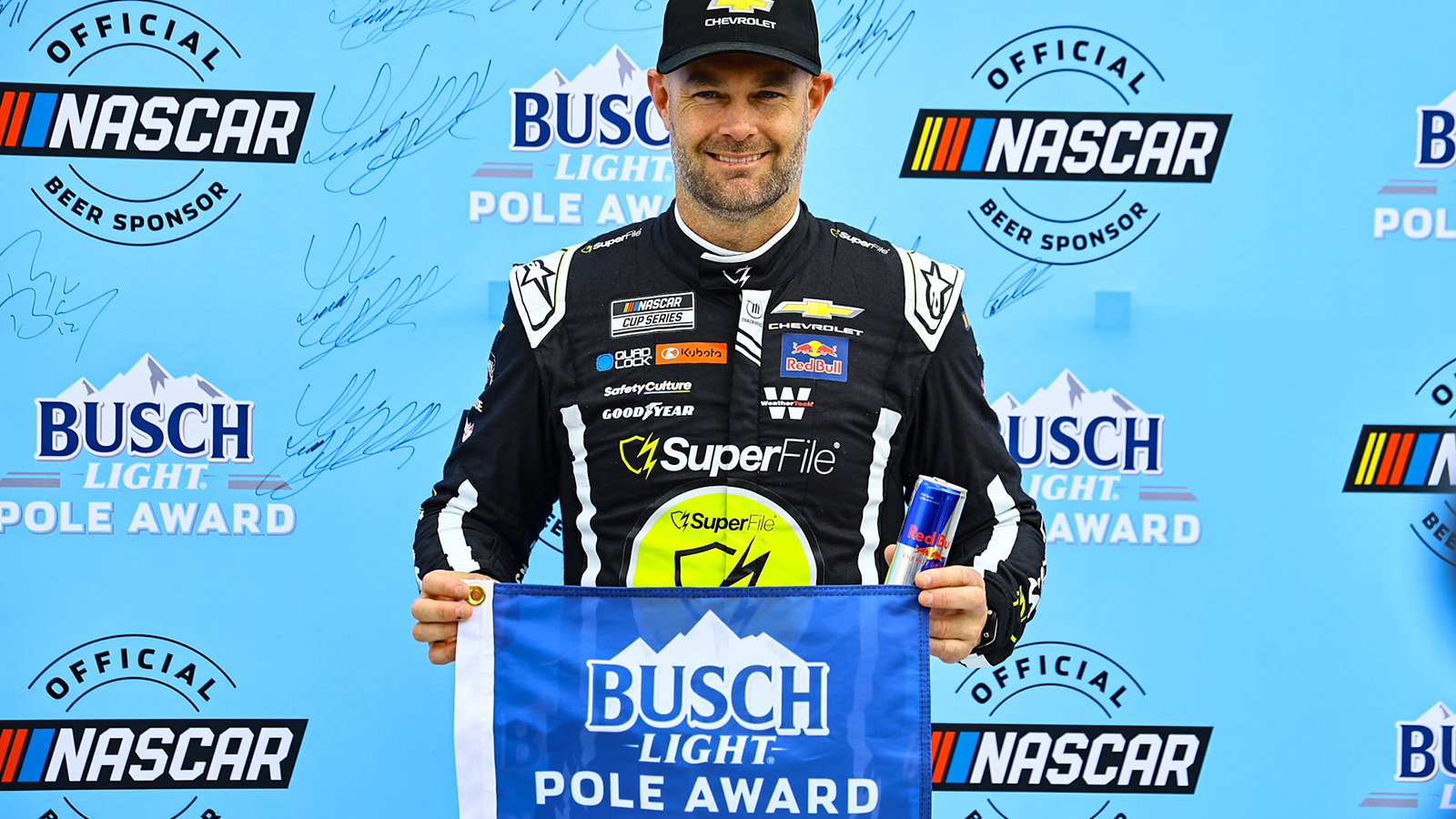 Shane van Gisbergen celebrates a pole position for the Go Bowling at The Glen