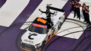 Corey Heim celebrates a win in the NASCAR Craftsman Truck Series race at Michigan International Speedway