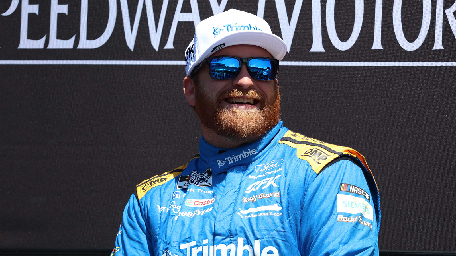 Chris Buescher will return to RFK Racing in 2027 on a multiyear contract extension.