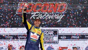 Denny Hamlin celebrates a win in The Great American Getaway 400 at Pocono Raceway on June 14, 2026.
