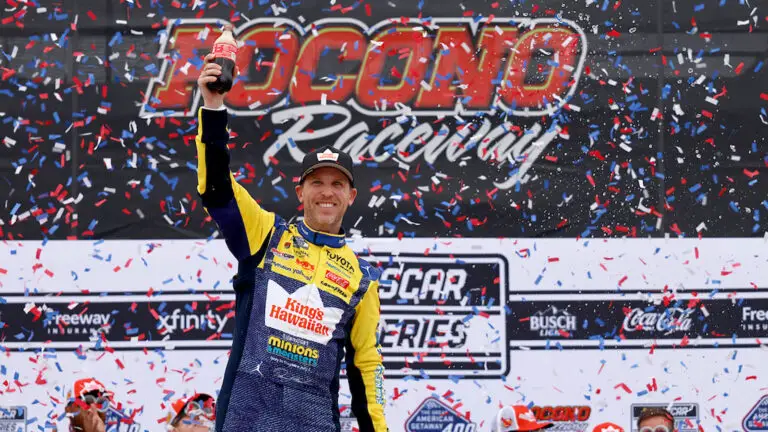 Denny Hamlin celebrates a win in The Great American Getaway 400 at Pocono Raceway on June 14, 2026.