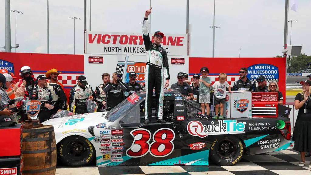Chandler Smith celebrates a win in the Faith Fest 250 at North Wilkesboro Speedway.