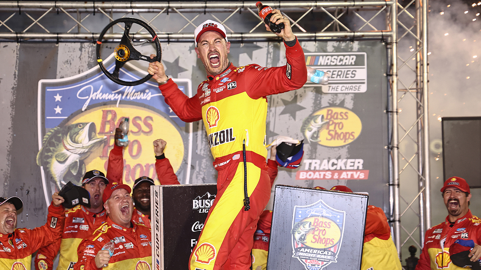 Joey Logano celebrates a win in the Bass Pro Shops Night Race at Bristol Motor Speedway