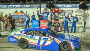 Corey Day celebrates in victory lane after a win in the Focused Health 302 at Las Vegas Motor Speedway.