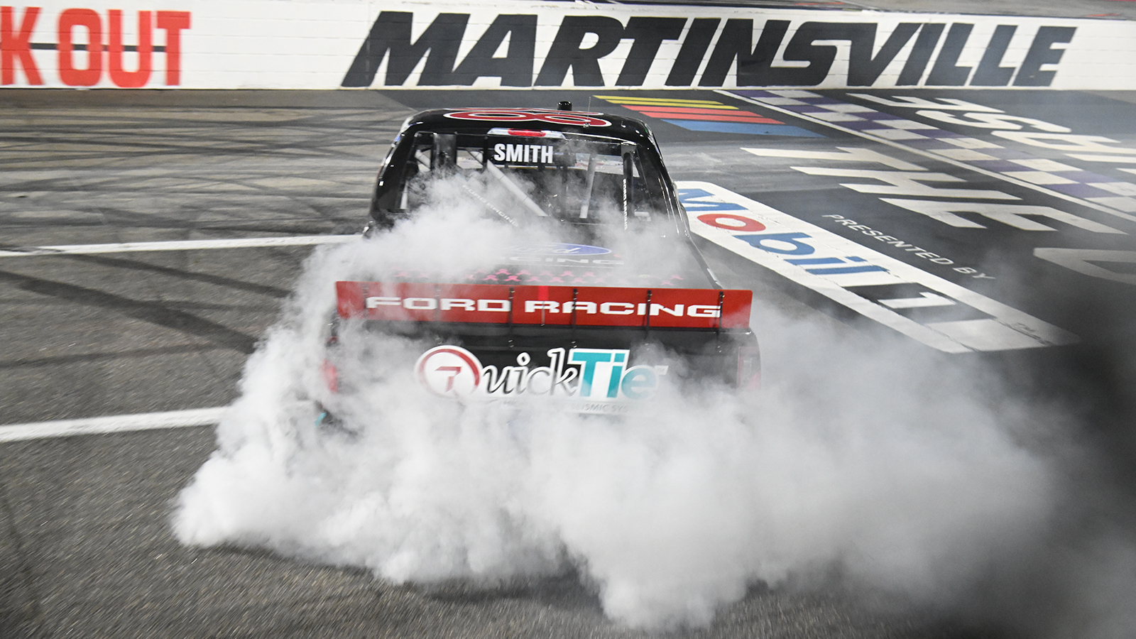 Chandler Smith celebrates a win in the Black's Tire 200 at Martinsville Speedway.