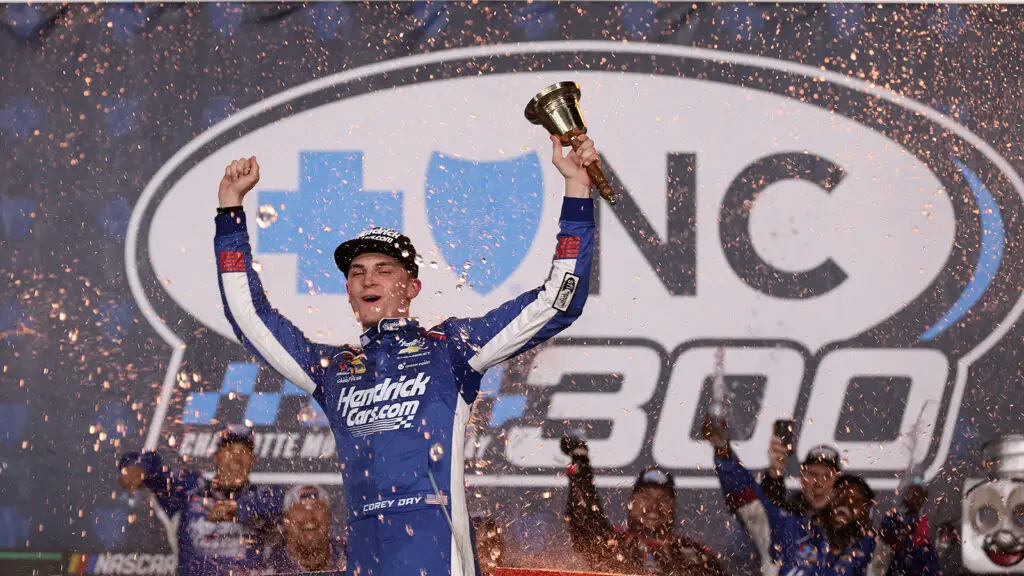 Corey Day celebrates a win in the 2026 Blue Cross NC 300 at Charlotte Motor Speedway.