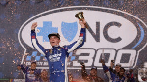 Corey Day celebrates a win in the 2026 Blue Cross NC 300 at Charlotte Motor Speedway.