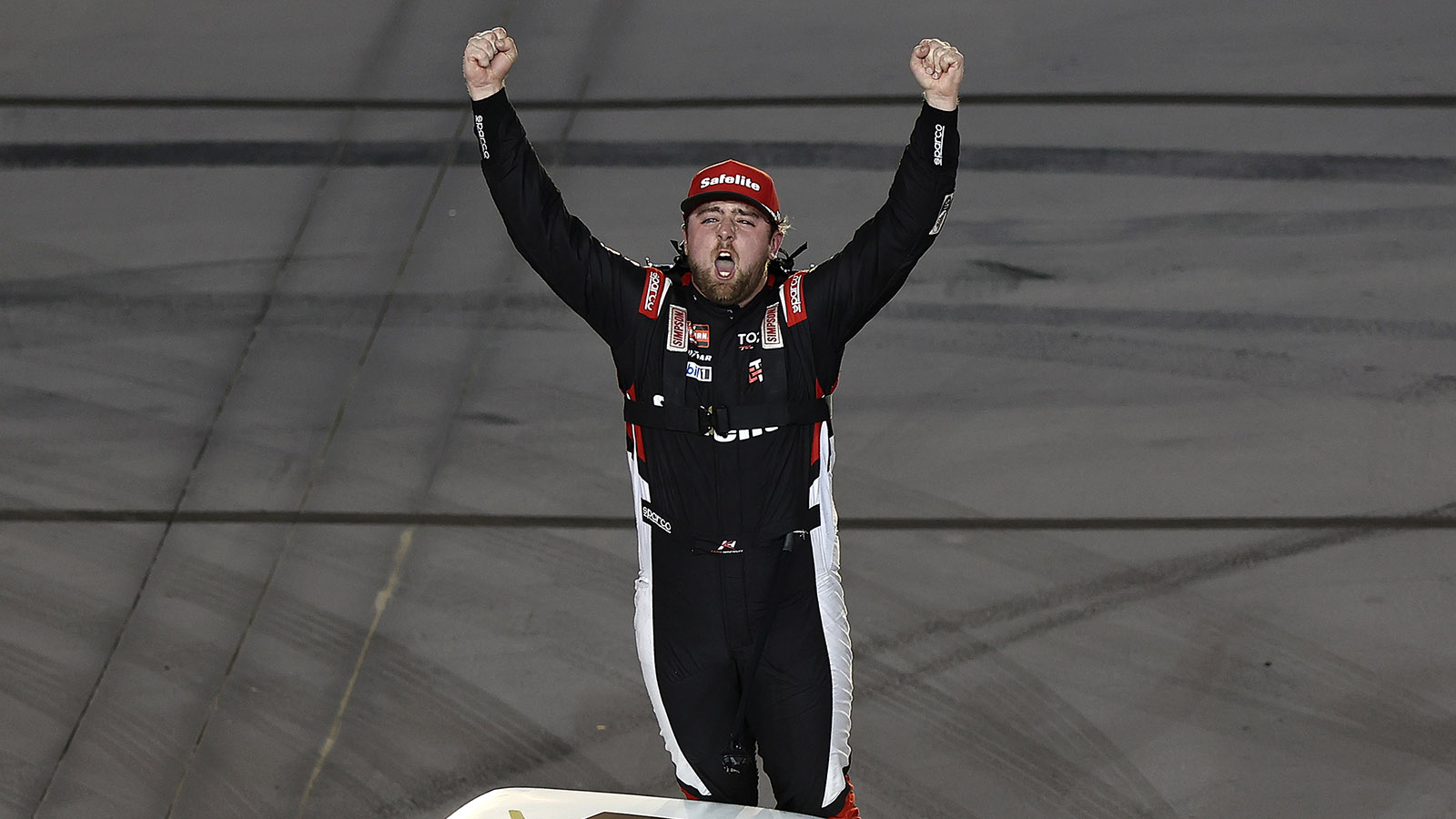 AVONDALE, ARIZONA - OCTOBER 16: Kaden Honeycutt, driver of the #11 Safelite Toyota, celebrates after winning the NASCAR Craftsman Truck Series Zero Carbon Bioethanol 150 Powered by POET at Phoenix Raceway on October 16, 2026 in Avondale, Arizona.