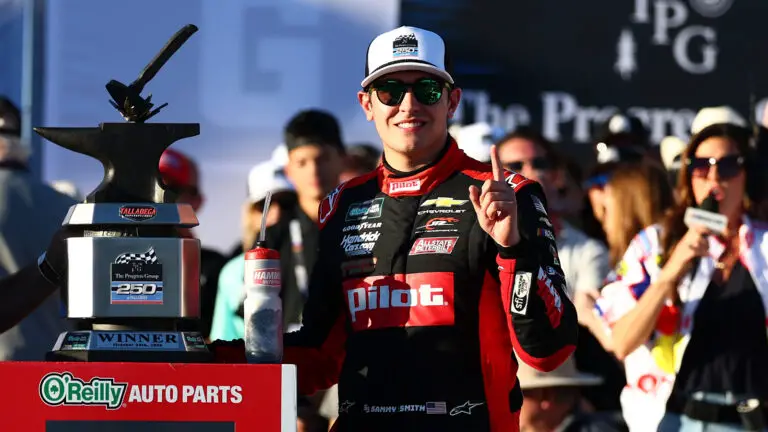 Sammy Smith poses with his trophy after winning The Progress Group 250 at Talladega Superspeedway