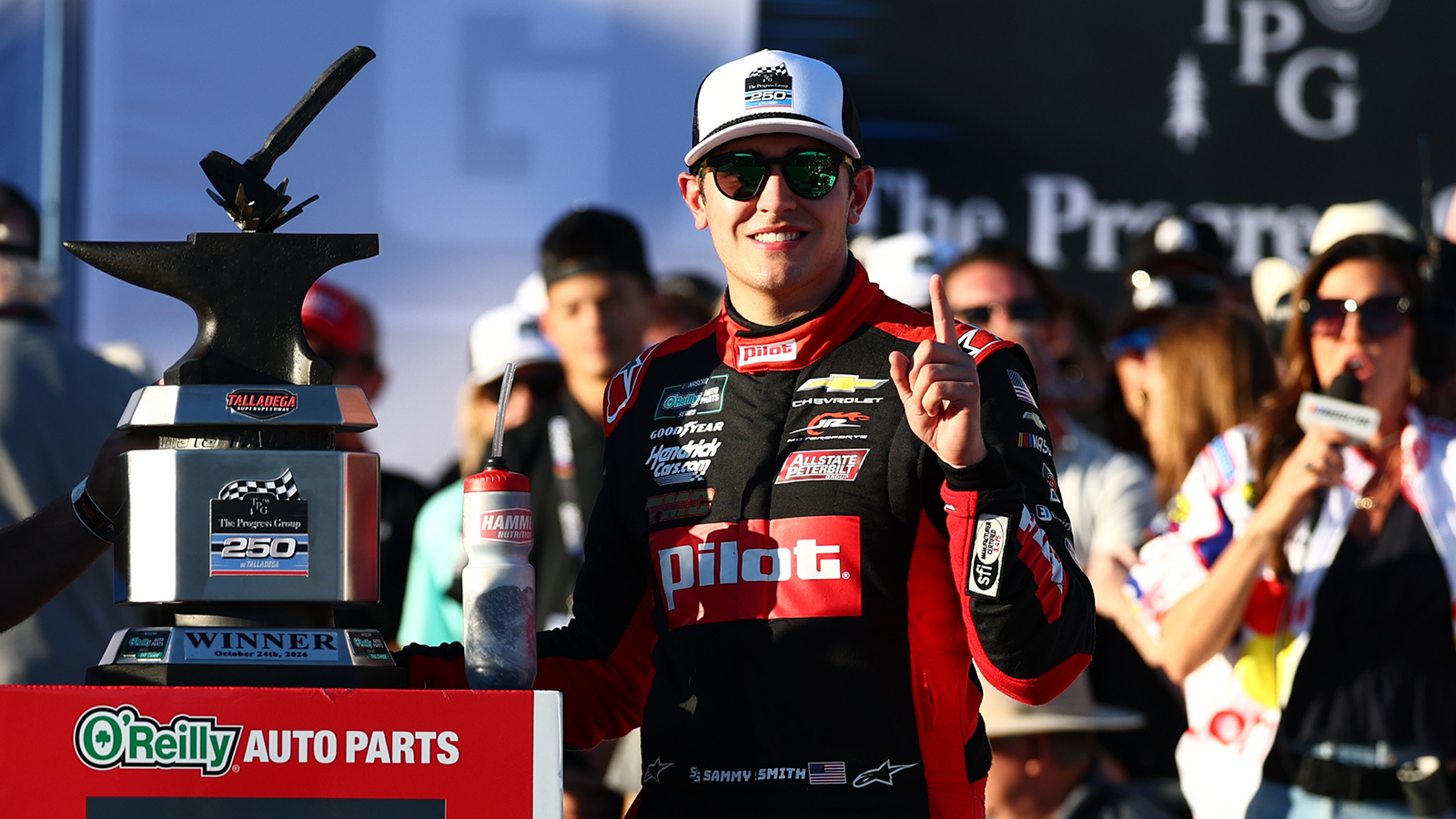 Sammy Smith poses with his trophy after winning The Progress Group 250 at Talladega Superspeedway